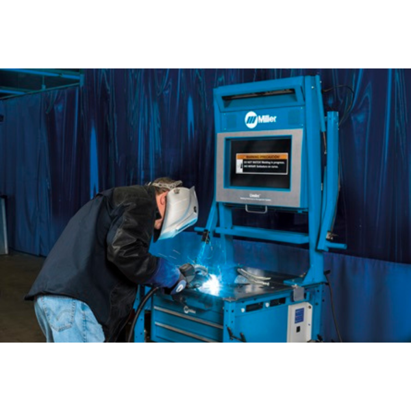 Student practicing welding on Miller LiveArc Welding Trainer