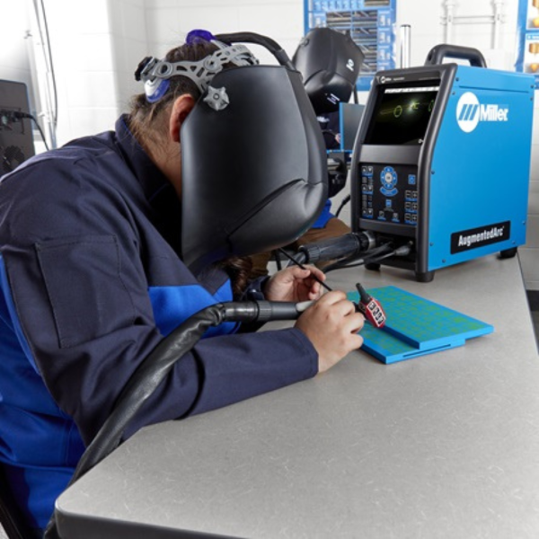 Student welding using AugmentedArc Augmented reality welding training.